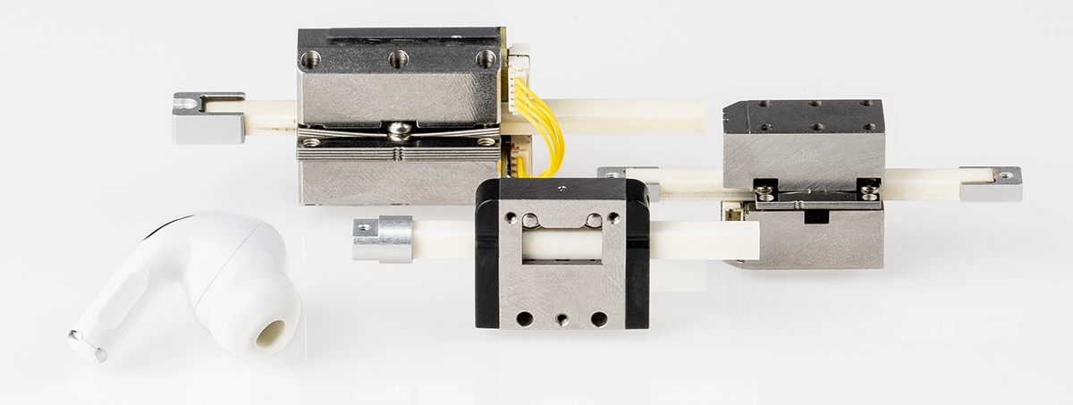 PiezoLEGS Standard Micro Motors size comparison with AirPods